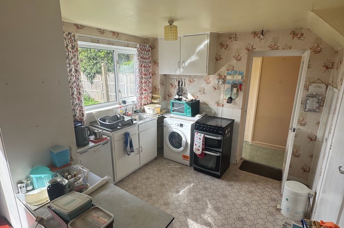 Midlands kitchen before HFC clearance — cluttered and full
